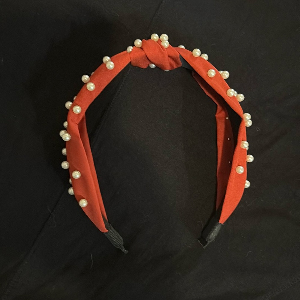 New without tags headband. Red with faux pearls.